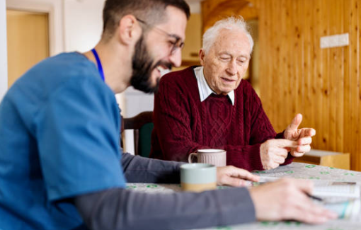 Caregiver providing companionship and support to a senior at home